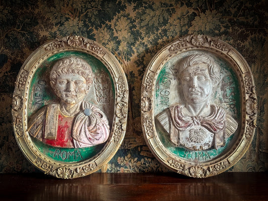 A Pair of Italian Carved Wooden Roundels of Nero and Augustus