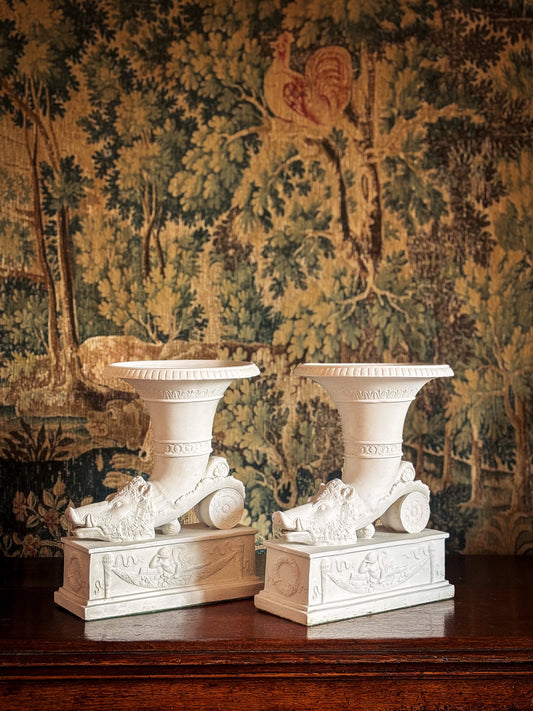 Pair of Continental biscuit porcelain ‘rhyton’ vases, probably German 19th century