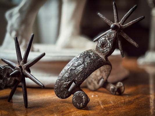 Pair of Iberian Silver-Inlaid Wrought-Iron Spurs
