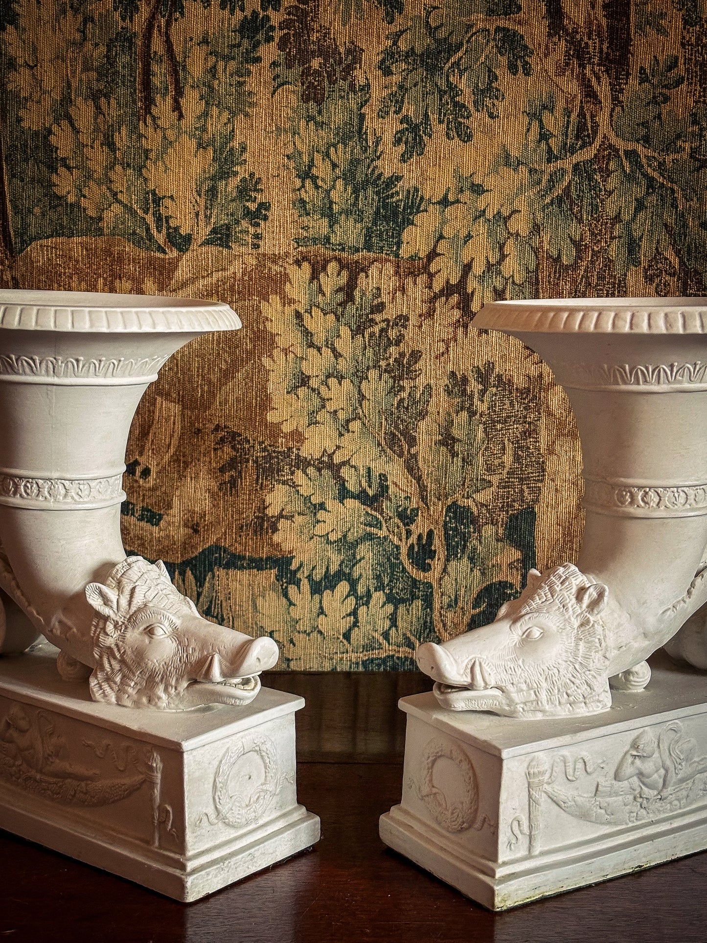 Pair of Continental biscuit porcelain ‘rhyton’ vases, probably German 19th century