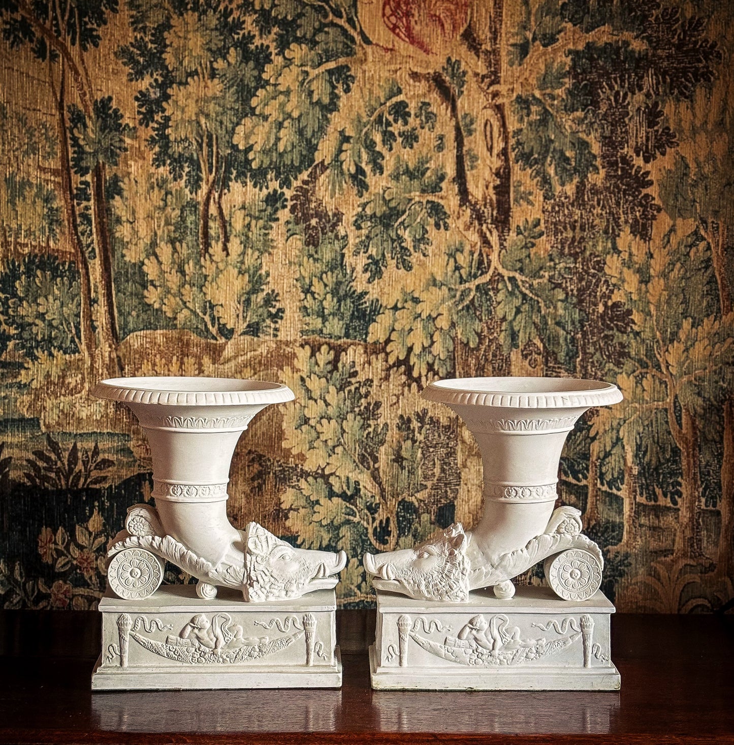 Pair of Continental biscuit porcelain ‘rhyton’ vases, probably German 19th century